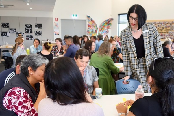 School Principal overlooking teachers planning